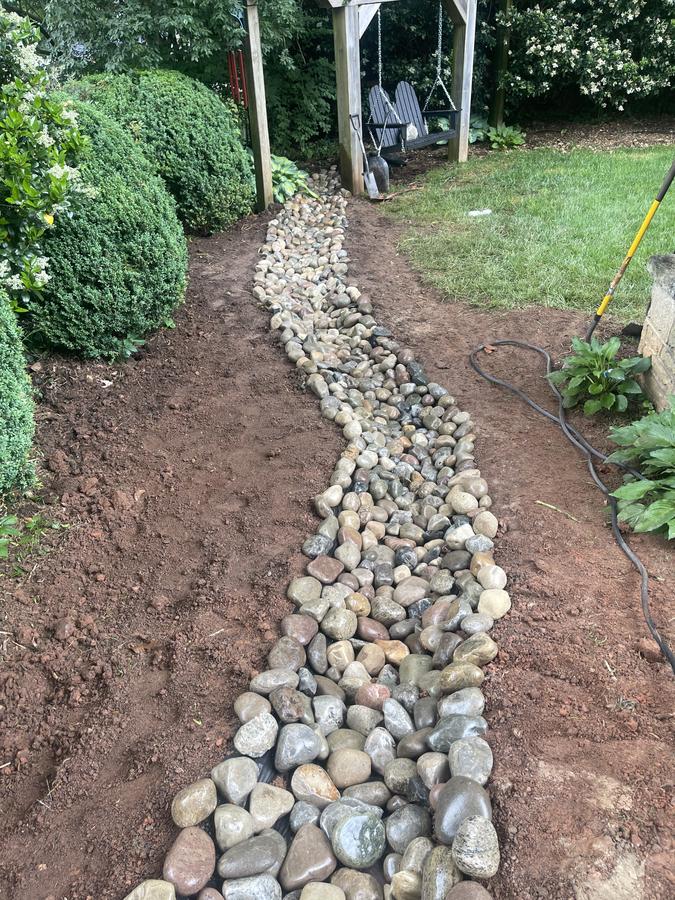 River rock channel installed