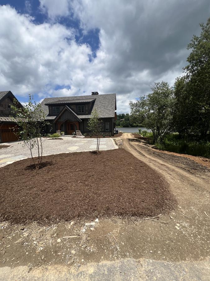 Lakefront stone and shake home with new landscaping and mulch beds — Foothills Outdoor Services Hickory NC